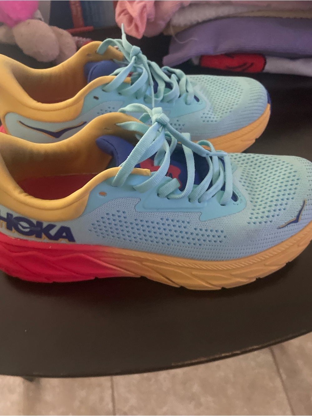 Hoka Women's Light Blue Running Shoes with Yellow and Pink Accents